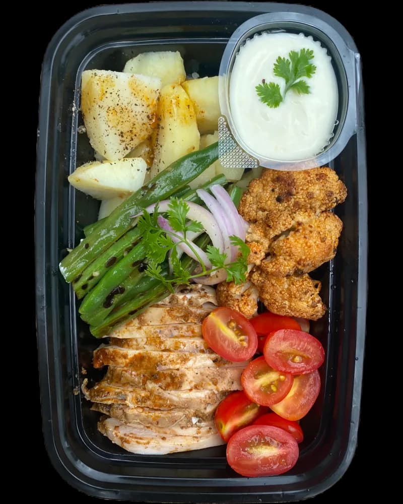 Harissa Chicken & Potatoes in a meal prep container