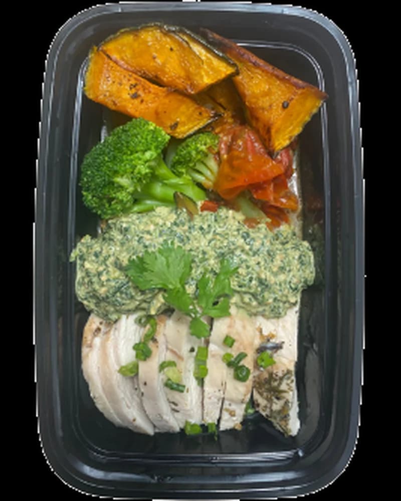 Spinach Pesto Chicken in a meal prep container